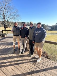Members of Lakeville Country Club enjoying themselves on the course-side deck.