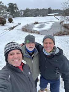 Members of Lakeville Country Club taking a photo on the golf course in the snow